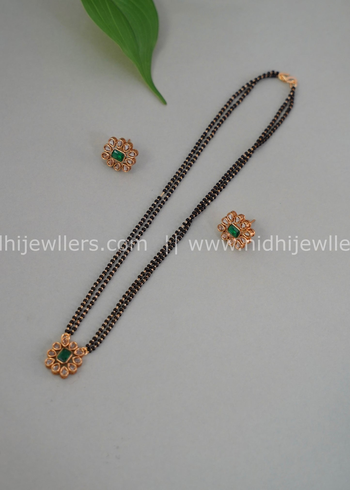 Black beads single layered floral neck piece.