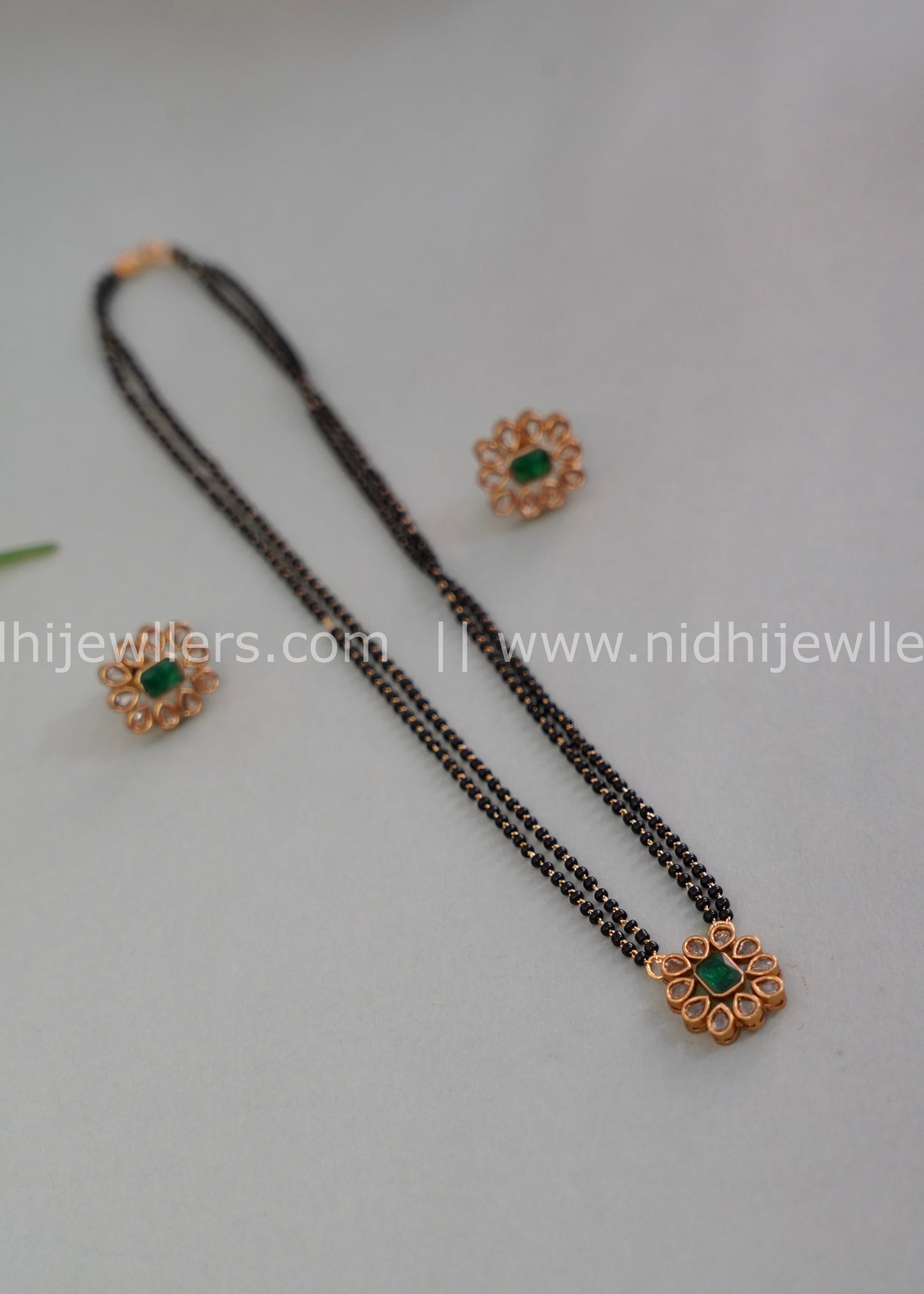 Black beads single layered floral neck piece.