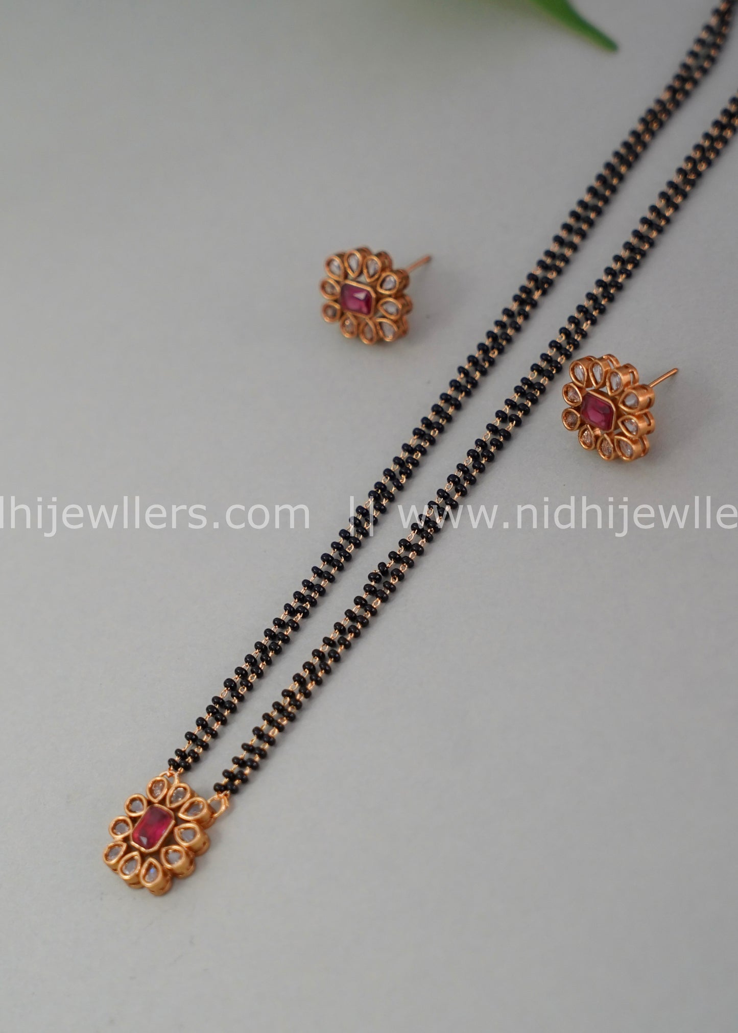 Black beads single layered floral neck piece.