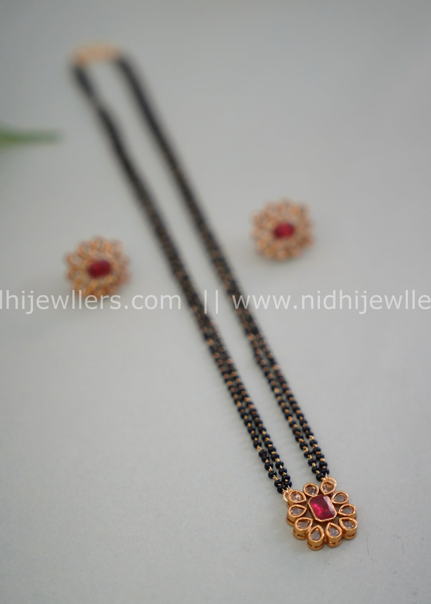 Black beads single layered floral neck piece.