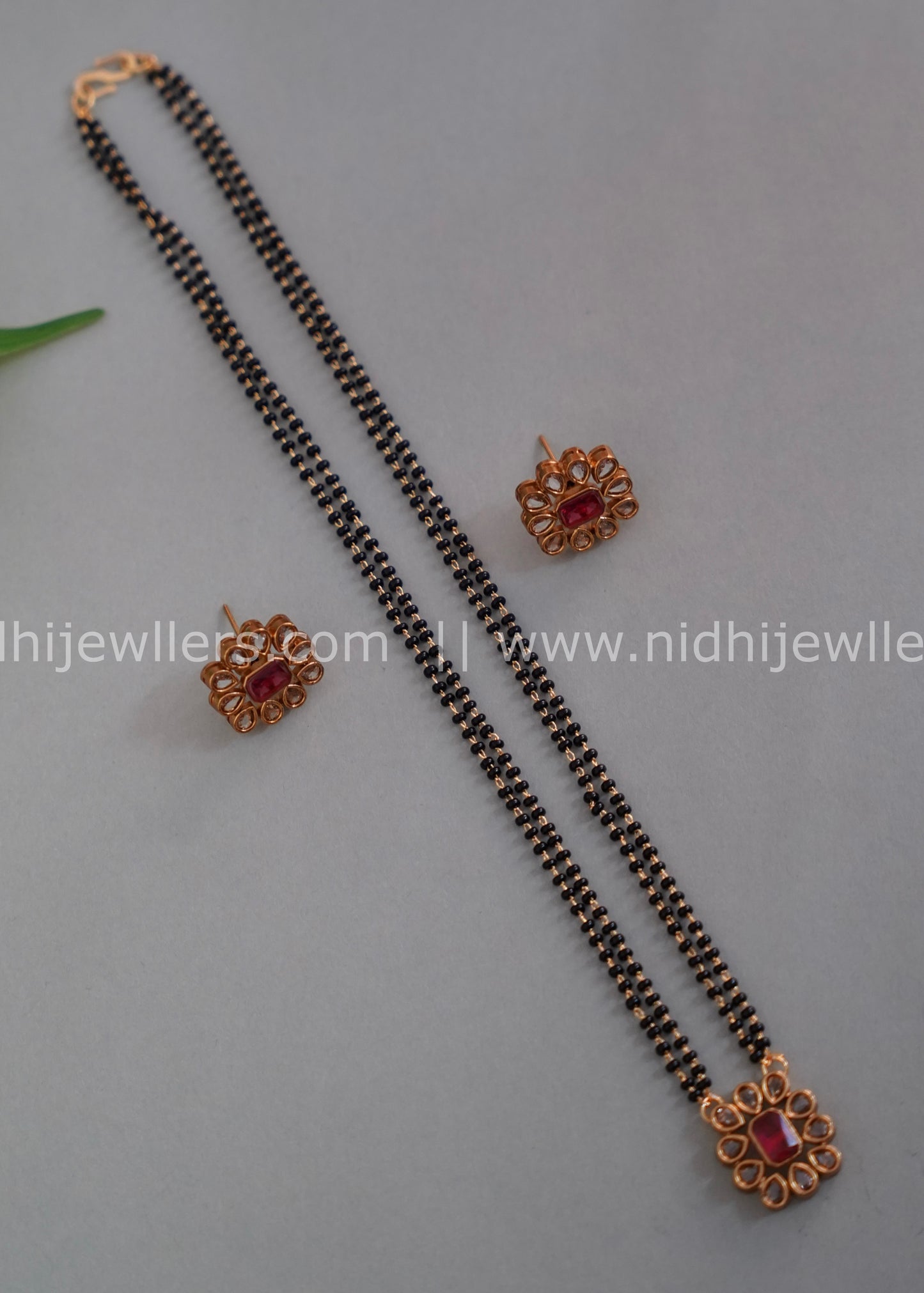 Black beads single layered floral neck piece.