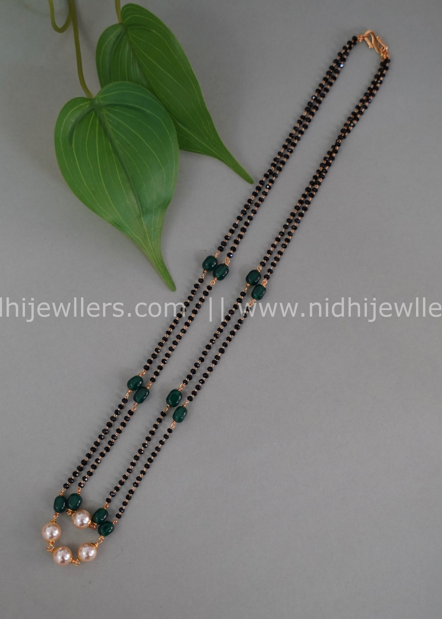 Black beads double layered neck piece.
