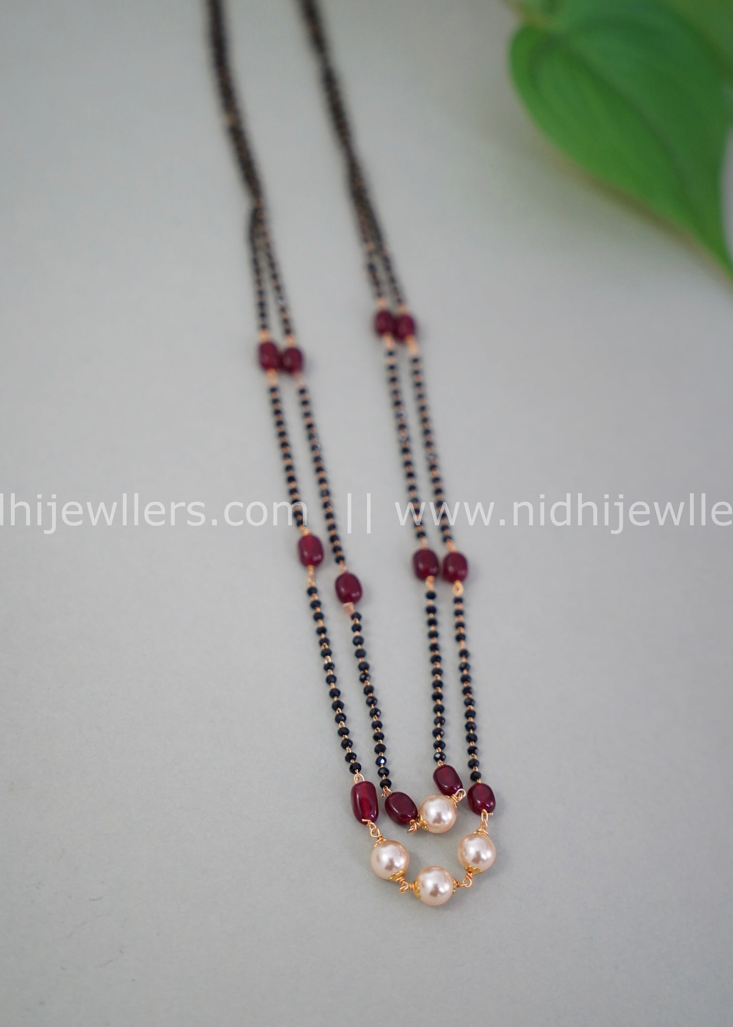 Black beads double layered neck piece.