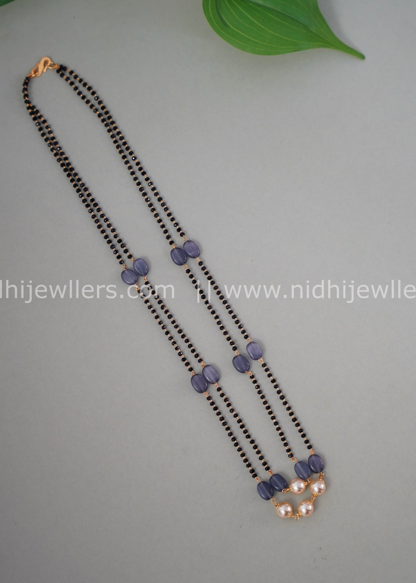 Black beads double layered neck piece.