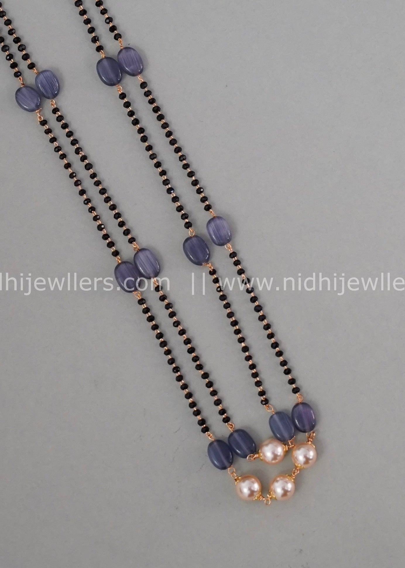 Black beads double layered neck piece.