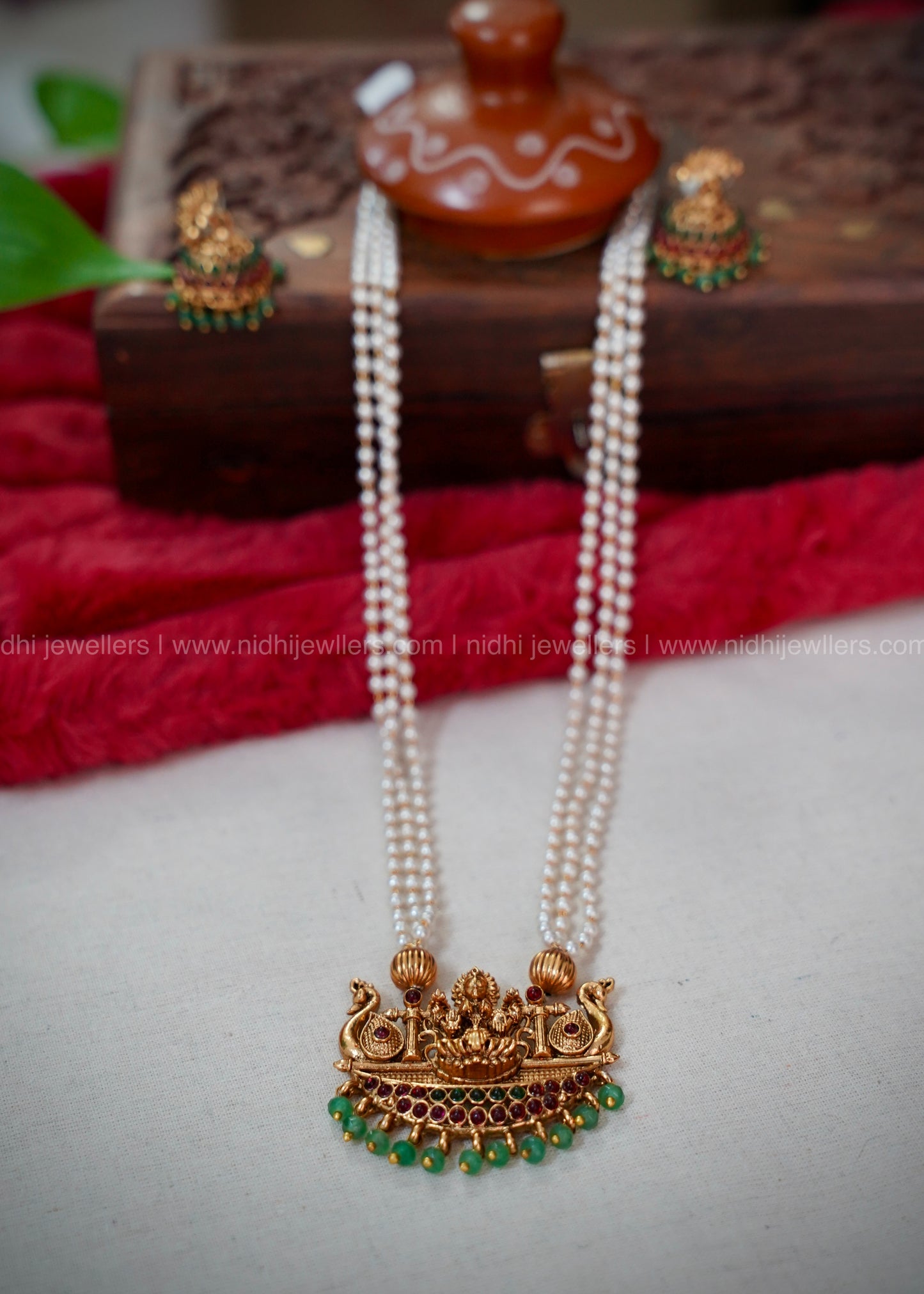 Lakshmi kemp haram with green beads pendant.