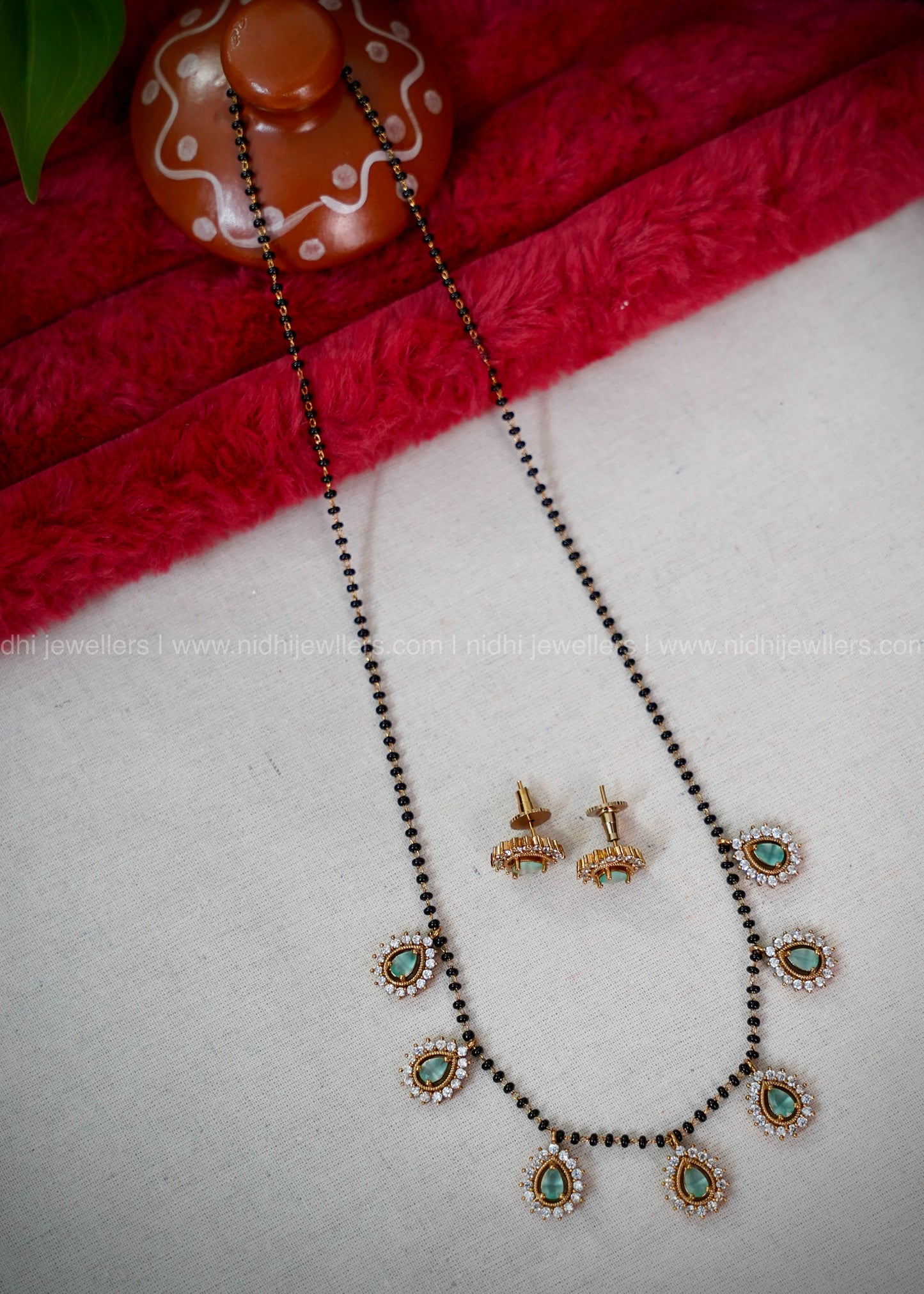 Black beads mint green AD neck piece.