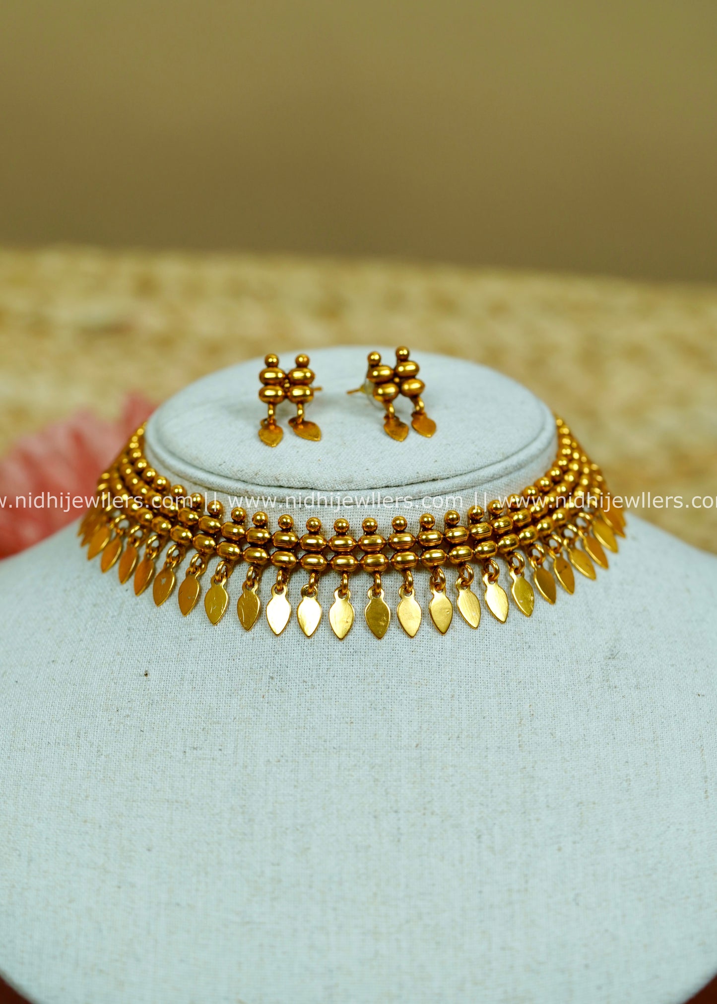 Antique Gold-Tone Beaded Elakkathali Necklace with Layered Leaf-Shaped Fringe-Pallavi