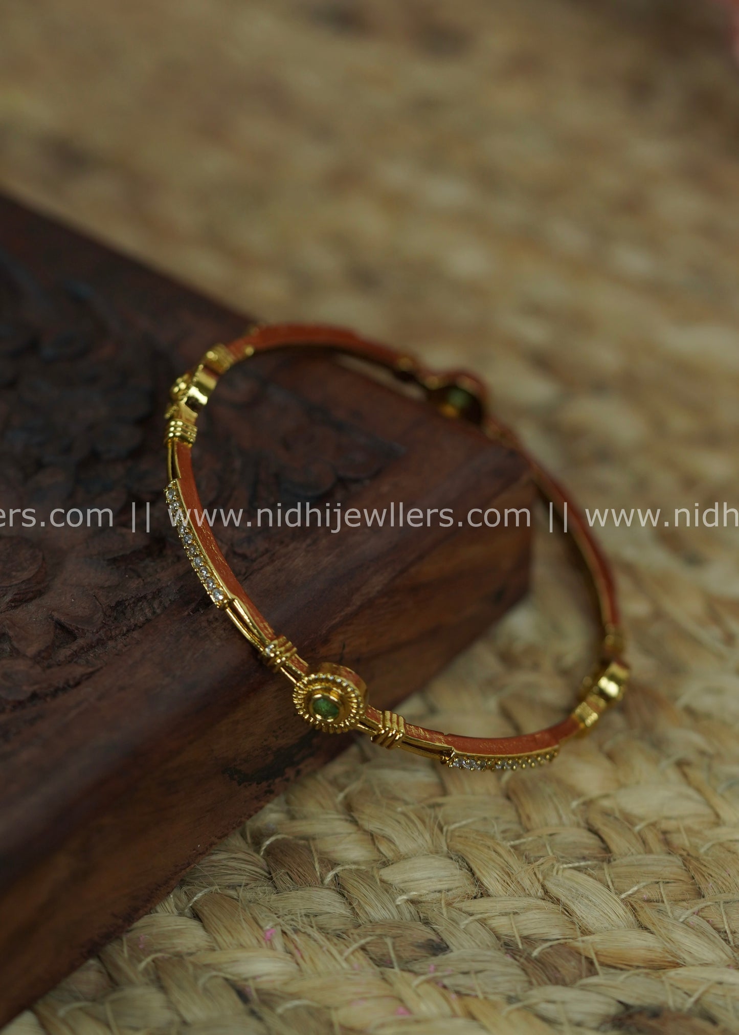Slender Segmented Bangle with White Stone Channels and Ruby-Green Accents