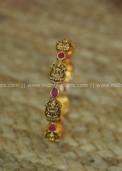 Antique Polished Goddess Lakshmi Temple Bangle with Teardrop Ruby Accents