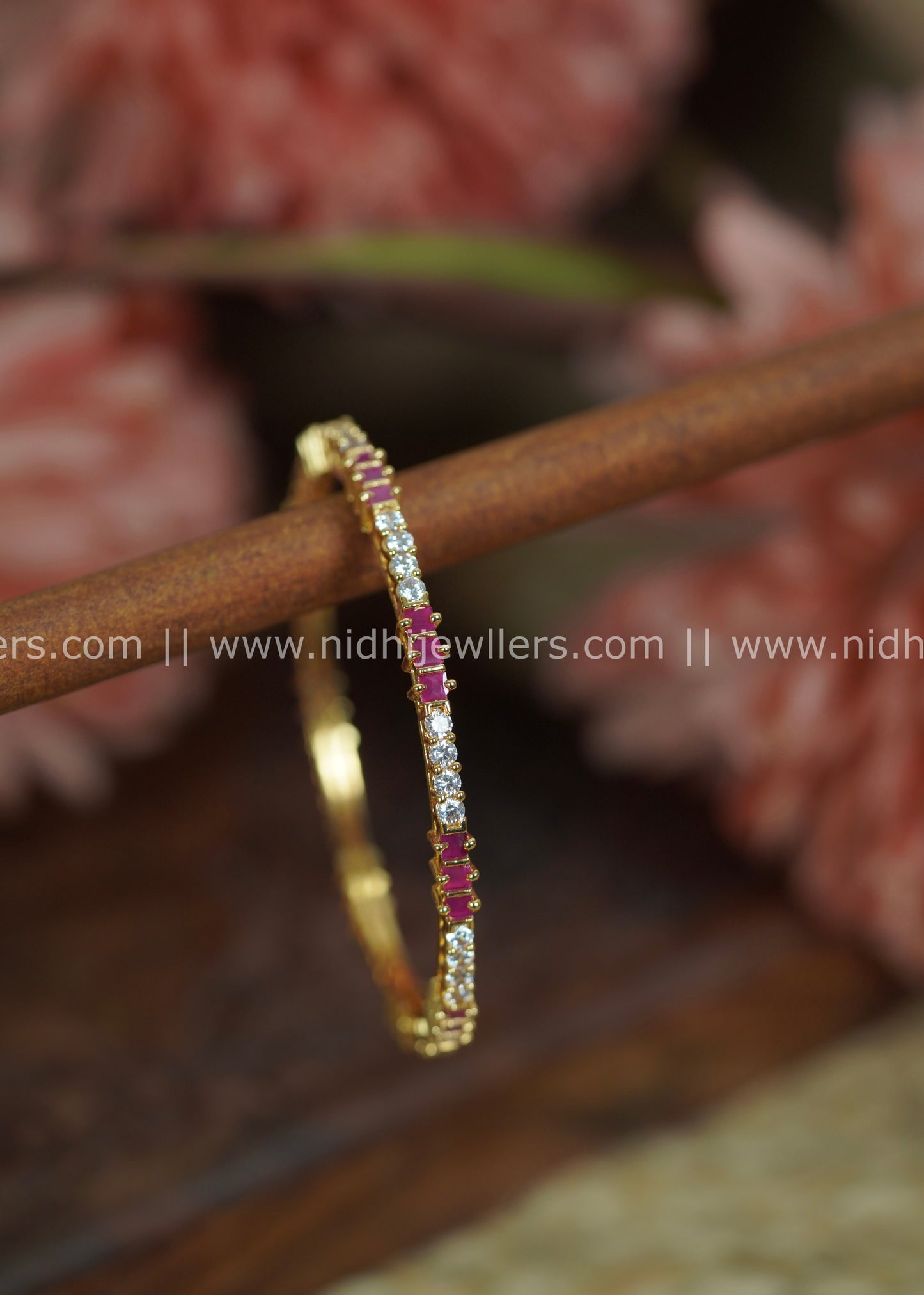 Gold-Color Slender Segmented Bangle with White Stone Blocks and Ruby Accents