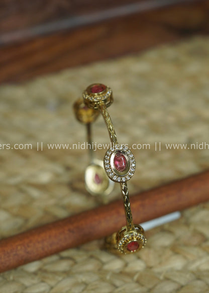 Gold-Tone Slender Chevron-Engraved Bangle with Ruby and White Stone Halos