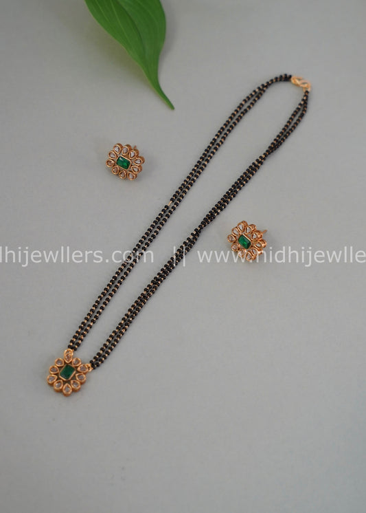 Black beads single layered floral neck piece.