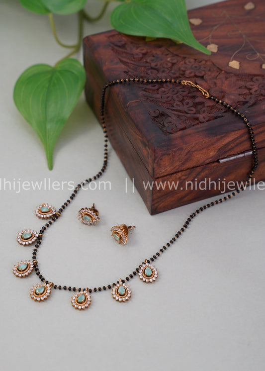 Black beads mint green AD neck piece.