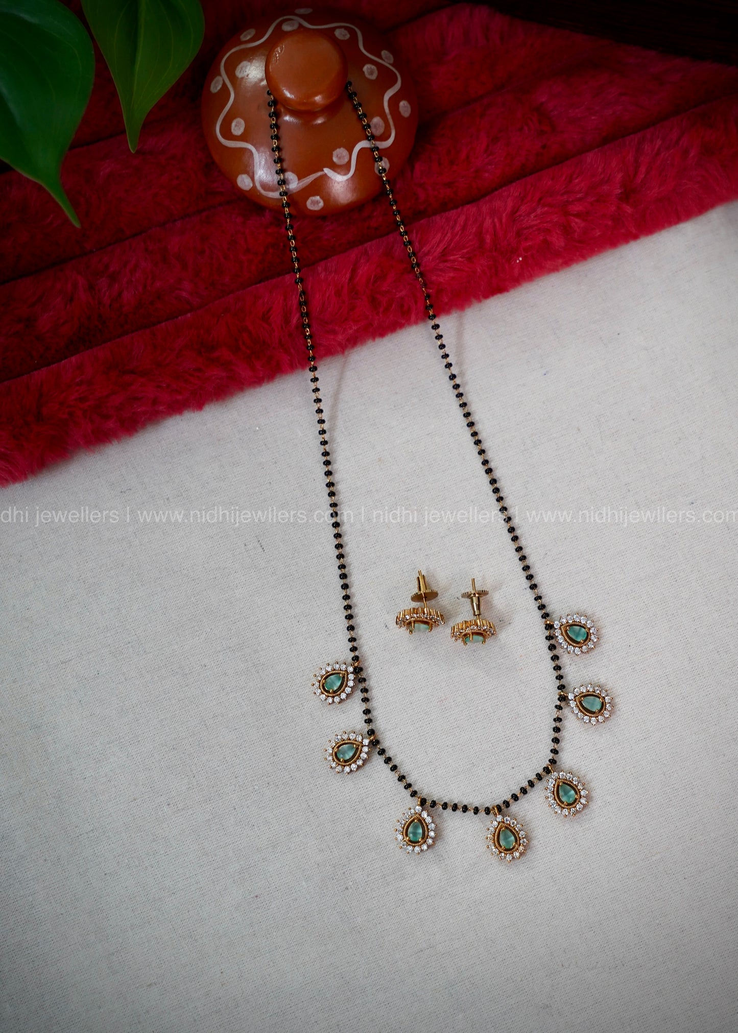 Black beads mint green AD neck piece.