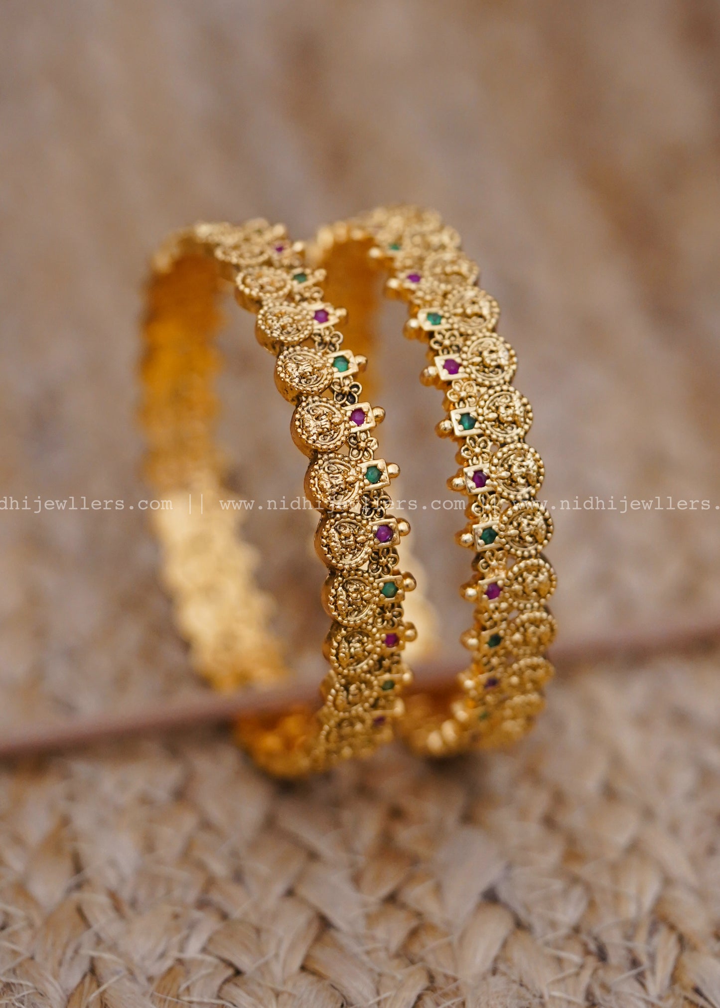 Traditional coin-style design with ruby and emerald stonework-thin