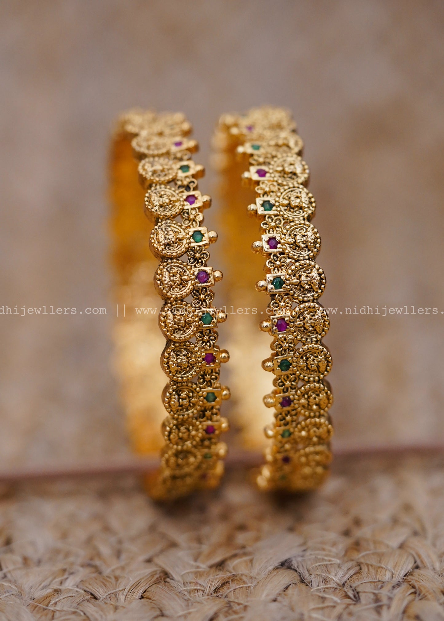 Traditional coin-style design with ruby and emerald stonework-thin